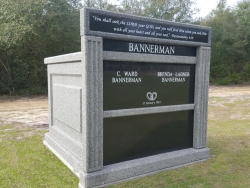 Customized four-space mausoleum light gray with large header on a foundation in Diamondhead, MS